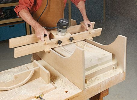 a man working on a piece of wood with a circular sawtoothing device in his hand