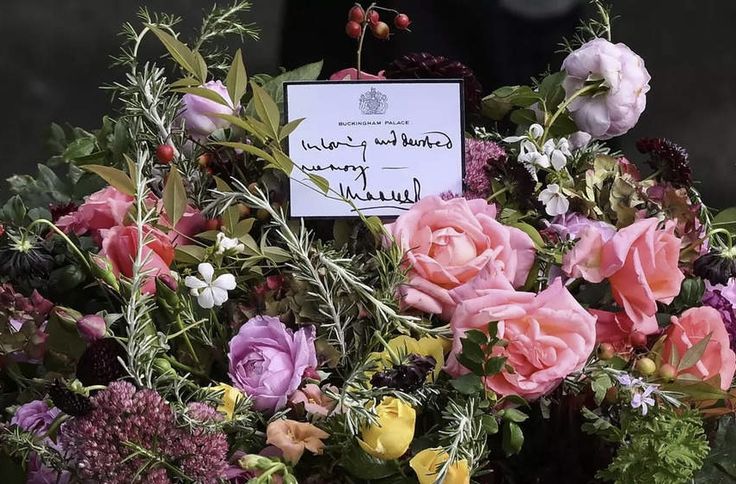 a bouquet of flowers with a note attached to it