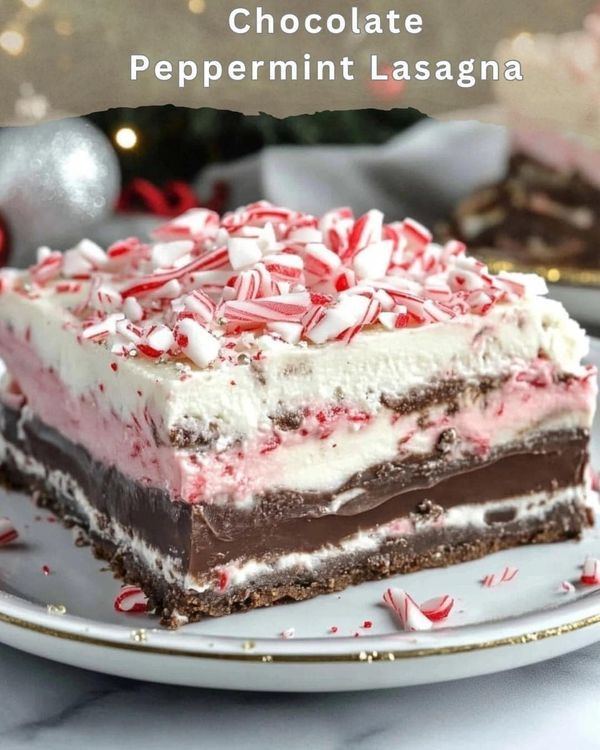 a piece of chocolate peppermint lasagna on a plate with candy canes