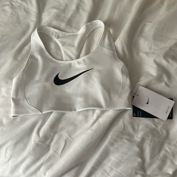 This Sports Bra Is A Nike Dri Fit. It Still Has Tags And Is In Perfect Condition. White Sweat Resistant Sports Bra For Light Sports, White Sweat-resistant Sports Bra For Light Sports, White Sweat Resistant Sports Bra For Gym, Sweat-resistant White Sports Bra For Gym, White Sweat-resistant Sports Bra For Gym, White Sweat-wicking Sports Bra, White Sweat Resistant Sports Bra, White Racerback Sports Bra For Light Sports, White Nike Racerback Top