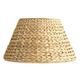 a lamp shade that is made out of straw