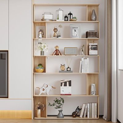 a living room with white walls and wooden shelves