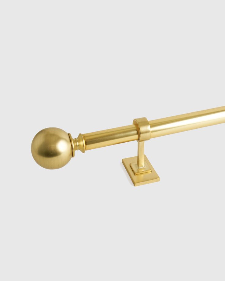 an image of a gold door handle on a white background