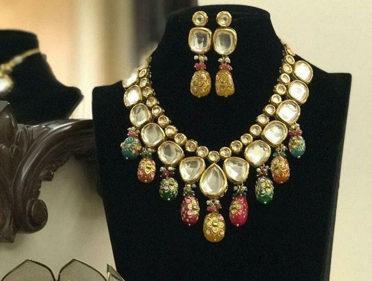 Tanjore kundan necklace set, simple kundan set, multi color kundan set, meena kundan necklace set, Indian kundan jewellery Product Description: * Tanjore kundan necklace set, simple kundan set, multi color kundan set, meena kundan necklace set, Indian kundan jewellery * The base metal color is Gold tone studded with kundan along with beads work on it. * This Jewelry set would add more charms to your beautiful jewelry collection and would surely bring lots of compliments . * Note:- This is an art Indian Kundan Jewellery, Necklace Set Simple, Artificial Jewelry, Kundan Necklace Set, Necklace Set Indian, Beads Work, Plastic Pouch, Kundan Set, Kundan Necklace