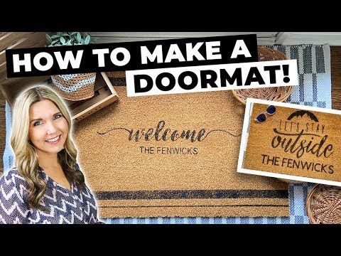 a woman standing in front of a welcome mat