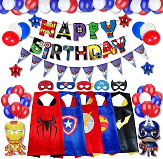 a birthday party set up with balloons, masks and streamers for an avengers theme