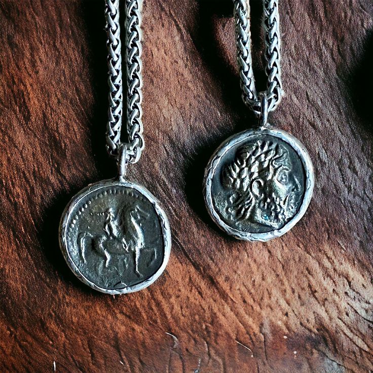 Marvelous reproductions of ancient Greek coins cast in bronze and set in a sterling silver setting.  The coin a features a bearded man on the from and a horse and rider on the back.   Hung on chunky oxidized silver wheat chain with lobster claw clasp.   Coin: 1" diameter  Chain:  Stainless Steel.  Choose your length.  Ready for gifting in a hand-stamped gift box and bow. To see all the goodies in my shop, click here: www.etsy.com/shop/OneTribeJewelry Symbolic Bronze Jewelry With Coin Pendant, Symbolic Handmade Coin Necklaces, Silver Coin-shaped Medallion Necklace In Brass, Handmade Sterling Silver Medallion Coin Necklace, Antique Sterling Silver Coin Necklace With Round Pendant, Handmade Sterling Silver Coin Necklace, Handmade Coin-shaped Sterling Silver Necklace, Hand Cast Silver Medallion Necklace, Sterling Silver Oxidized Coin Necklace