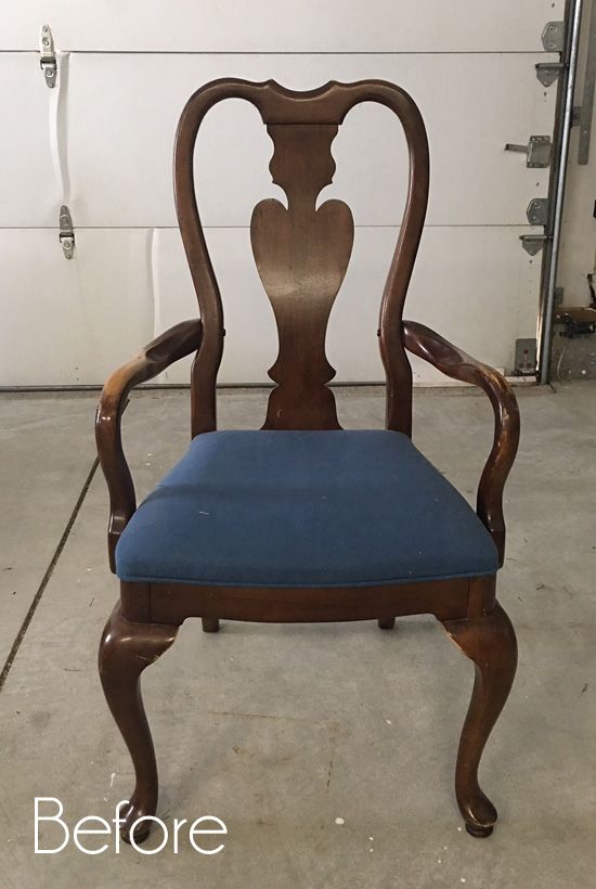 an old chair is upholstered with blue fabric to give it a new look