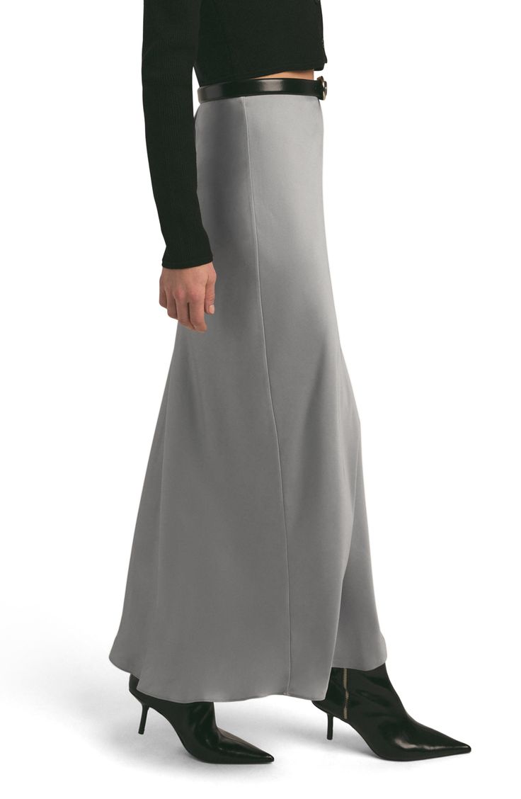 This curve-hugging maxi skirt is a sleek and modern addition to your everyday wardrobe. 39" center front length (size Medium) Lined 100% polyester Dry clean or machine wash, line dry Imported Elastane Maxi Length Skirt, Formal Fitted Maxi Length Bottoms, Elegant Stretch Floor-length Bottoms, Fitted Maxi Skirt Made Of Elastane, Fitted Maxi Skirt In Elastane, Fitted Elastane Maxi Skirt, Formal Stretch Lined Maxi Skirt, Fitted Maxi Skirt For Formal Occasions, Fitted Maxi Length Elastane Skirt