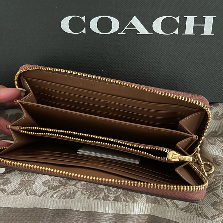 This Listing Is For The Coach Wallet! Zipper Closure With Hand Strap! Zipper Compartment Inside! Twelve Card Holders! Two Bill Compartments! Coach Clutch With Zipper For Daily Use, Coach Travel Wallet With Zipper Closure, Coach Travel Wallets With Zipper Closure, Coach Wallets With Zipper Closure For Everyday Use, Coach Wallets With Zipper Closure For Travel, Coach Wallets With Zipper Closure, Coach Leather Wallets With Zipper Closure, Chic Coach Wallet With Zipper Closure, Slim Calves