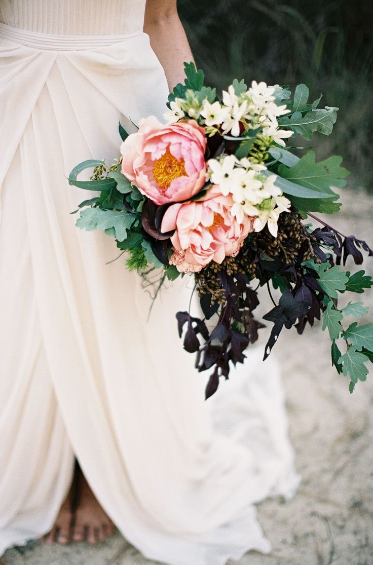 a woman holding a bouquet of flowers in her hand with a quote on the side