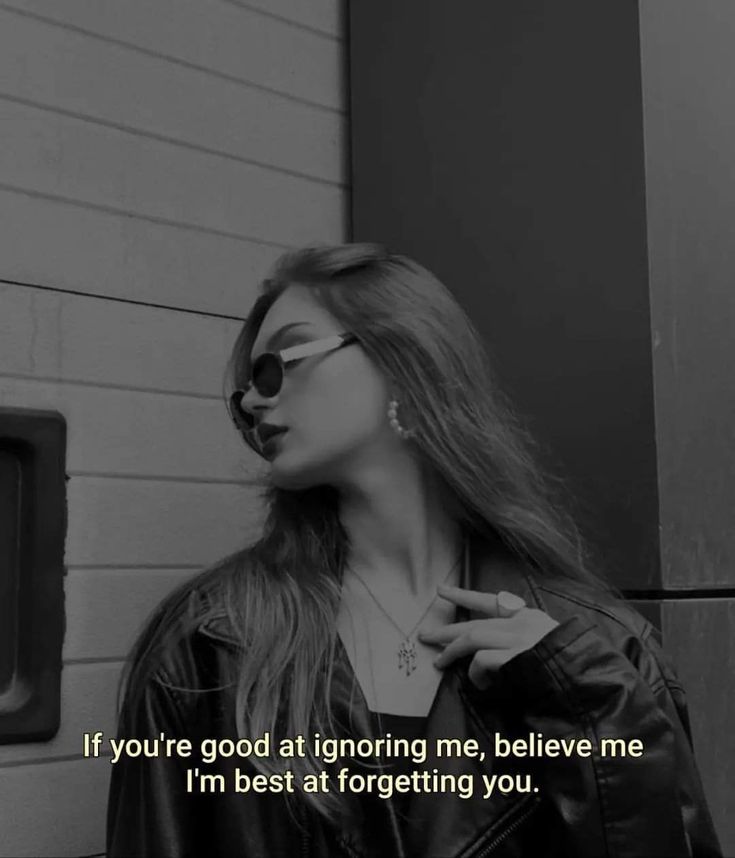 a woman wearing sunglasses standing in front of a brick wall with the words if you're good at ignoring me, believe me i'm