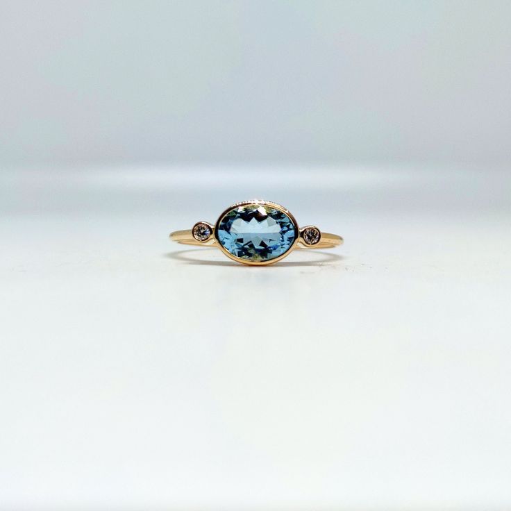 Band : Goldsmith Jewellers Material : 14K Gold Gemstone : Aquamarine, Diamond Aquamarine Stone Wight : 1.15 Caret, Stone Size : 8 x 6 mm Diamond Stone Wight : 0.05 Caret, Stone Size : 2.00 mm Ring Wight : 1.620 gm Stone Shape : Oval, Round Band Color : Gold Ring Size : All Size Available Made to Order Please Give Your Opinion or Feedback About The Product Note : This Ring You can be Put All Stones of Your Choice. https://www.etsy.com/in-en/your/shops/GoldsmithJewellers/onboarding/listings/create Minimalist Aquamarine Gemstone Rings, Yellow Gold Aquamarine Ring As Gift, Gift Aquamarine Crystal Ring With Accent Stones, Oval Aquamarine Multi-stone Rings, Gold Aquamarine Ring, Gold Ring Diamond, Unique Gold Rings, Aquamarine Crystal Ring With Accent Stones, Gift, March Birthstone Ring