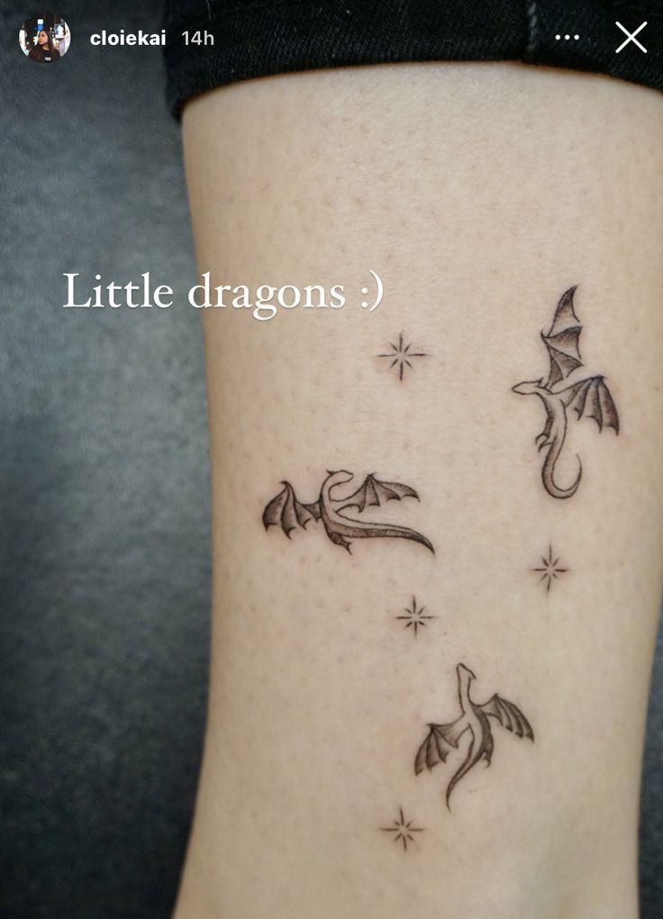 a small tattoo on the side of a woman's leg that reads little dragon