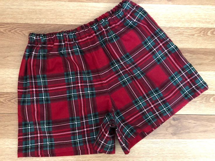 "ATTENTIONWE ARE AT FULL CAPACITY FOR  DELIVERY BY CHRISTMAS FOR 2023 . You can still place an order, however..we can not guarantee that it will ship, or that you will  receive it by Christmas Day!Listing is one pair of Christmas Red Traditional Tartan Plaid Flannel Shorts! You can find the matching pants here: https://www.etsy.com/listing/1277105502/christmas-red-green-and-black-tartan?click_key=2f6d24366a437ab3af1b2ace73ad93e767b837fe%3A1277105502&click_sum=53849096&ref=shop_home_active_3&frs=1&sts=1   - 100% Cotton Flannel - 1/2 inch elastic waistband - available w/wo a bow accent at waist -Handmade here in Virginia by me. How do you find your size????? measure your hips and then look at \"my\" size chart, Women's Waist: XS (25-27) S(28-29) M(29-30 L(31-32) XL(32-33) XXL(34-36) inches H Vacation Shorts, Flannel Shorts, Black Tartan, Flannel Pajamas, Sleep Shorts, Matching Pants, Christmas Red, Christmas Pajamas, Pajama Shorts