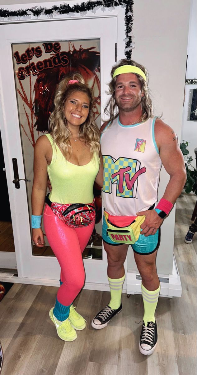 a man and woman dressed up in wrestling gear