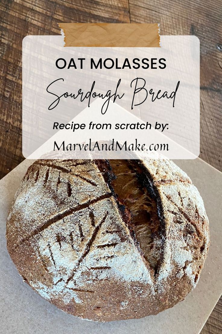 a loaf of bread sitting on top of a cutting board next to a sign that says, oat molassses sourdoug bread recipe from scratch by mary and make