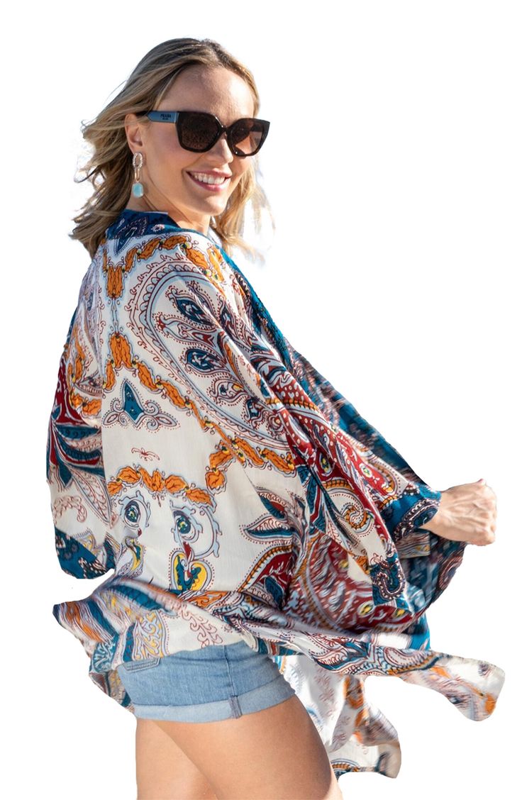 Love to layer all of your look in this bohemian-inspired duster that is covered in a bright medallion pattern. Open front Short sleeves 100% rayon Hand wash, line dry Imported Model stats: 5'10", 32" bust, 25" waist, 36" hip. Model is wearing size One Size. Bohemian Floral Print Outerwear For Vacation, Bohemian Floral Print Vacation Outerwear, Bohemian Patterned Kimono With Vibrant Print, Bohemian Printed Summer Outerwear, Bohemian Multicolor Outerwear For Vacation, Summer Bohemian Patterned Outerwear, Bohemian Floral Print Outerwear For Beach, Bohemian Outerwear With Floral Print For Beach, Bohemian Outerwear For Beach