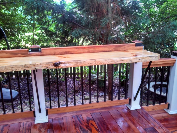 a wooden bench sitting on top of a wooden deck