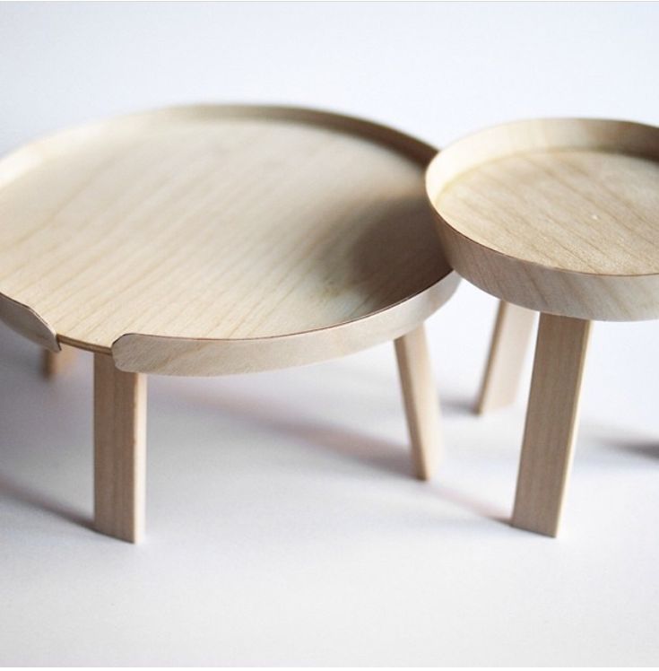 two small wooden tables sitting on top of each other