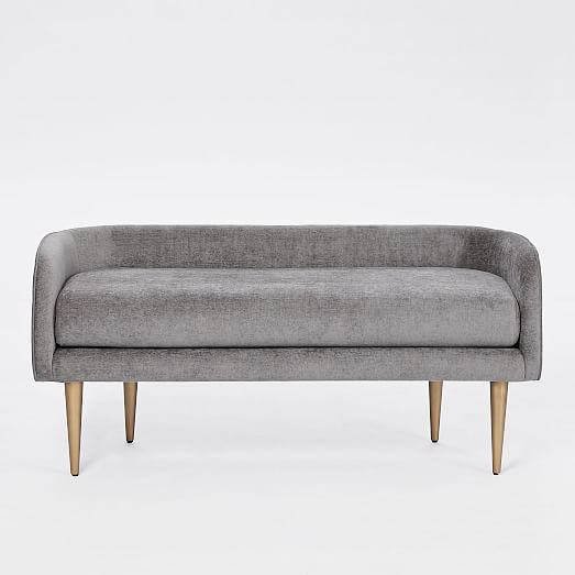 a grey couch with wooden legs on a white background