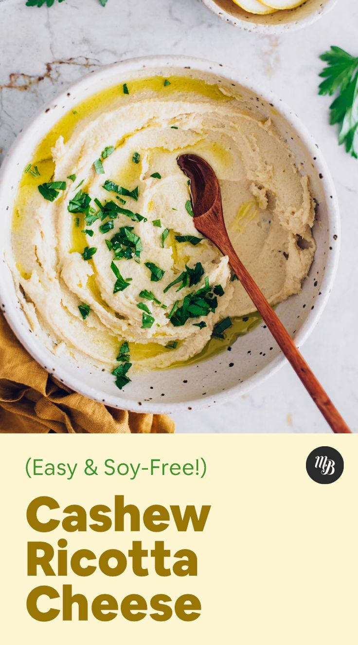 a white bowl filled with cashew ricotta cheese and topped with fresh parsley