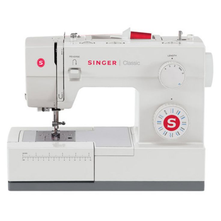 the singer sewing machine is white and has red buttons on it's front end