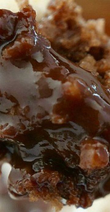 a close up of food on a plate with chocolate sauce and breadcrumbs