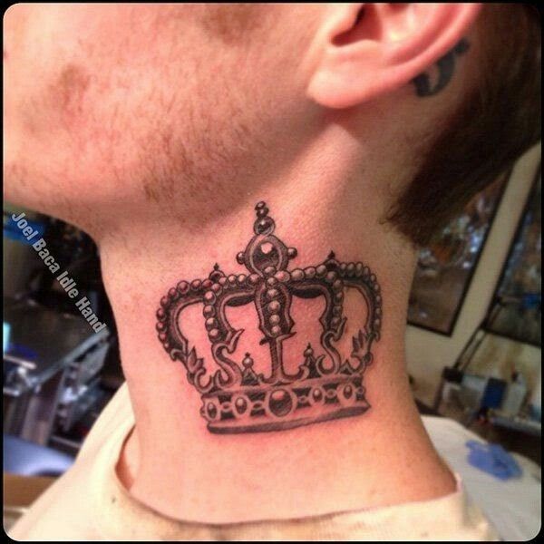 a man's neck with a crown tattoo on the side of his neck,