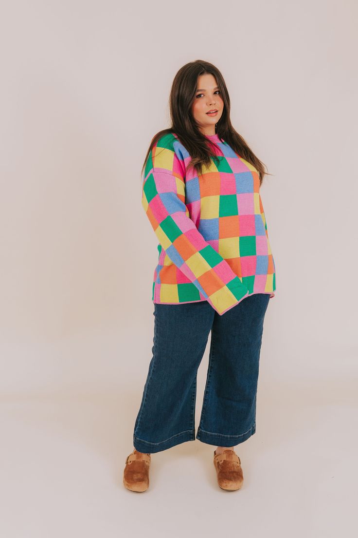 Fashionably transition between seasons in this vibrant PLUS SIZE - Between Places Sweater! With its cheerful multi-colored checker pattern, ribbed neckline, and pullover style, you can make a statement while staying comfortable. Details Multi-color blocked checker pattern Pullover sweater Ribbed neckline Colors are pink, blue, lime, orange, and green Sizing *Measurements are taken unstretched with item hanging* Approximate measurements: SIZE LENGTH BUST 1XL 29.5" 54" 2XL 30" 56" 3XL 30.5" 58" Fa Playful Fall Tops In Bright Colors, Plus Size Colorful Outfits, Rainbow Sweater Outfit, Nursing Friendly Tops, Nursing Friendly Dress, Plus Jumpsuit, Checker Pattern, Plus Size Sweater, Colorful Outfits