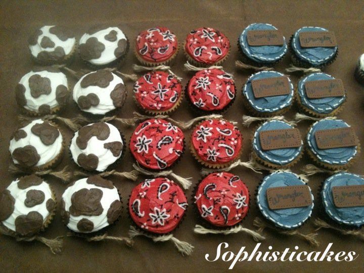 several decorated cupcakes are displayed on a table