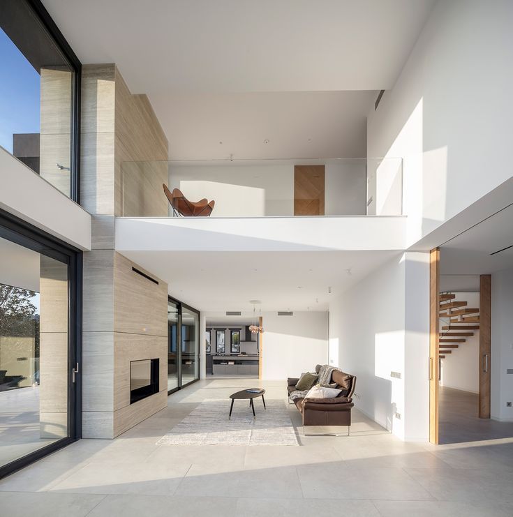 an open living room with white walls and flooring