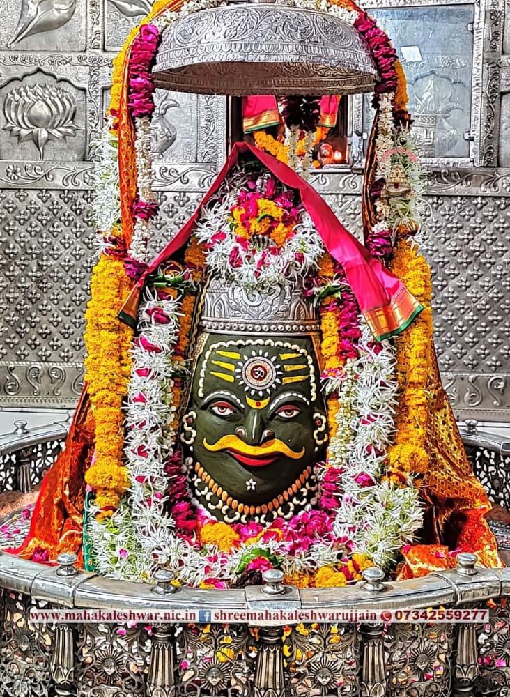 the idol is decorated with flowers and garlands