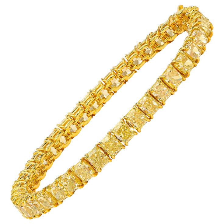 This beautiful tennis bracelet features 42 perfectly matched Fancy Yellow Cushion Cut Diamonds set in a single line bracelet. Measure 6.75 inches. Set in 18 Karat Yellow Gold. Canary Yellow Diamond Bracelet, Yellow Diamond Bracelet, Canary Yellow Diamonds, Canary Diamond, Yellow Cushion, Platinum Bracelet, Yellow Bracelet, Fancy Yellow Diamond, Yellow Jewelry