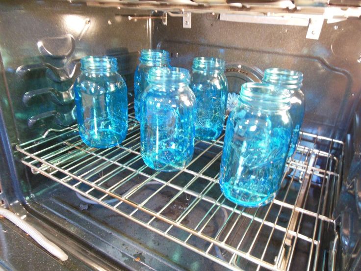 there are many blue glass bottles in the oven