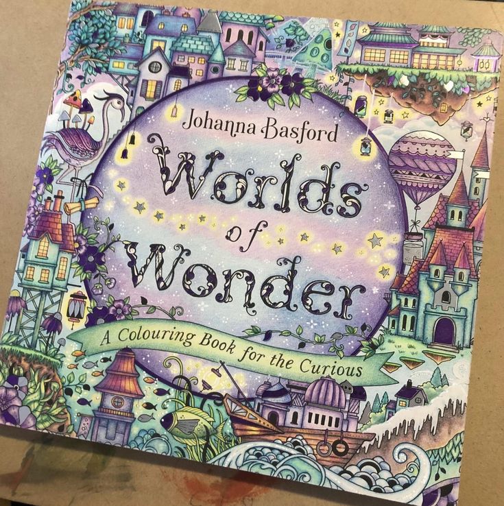 an adult coloring book with the title world of wonder written on it's cover