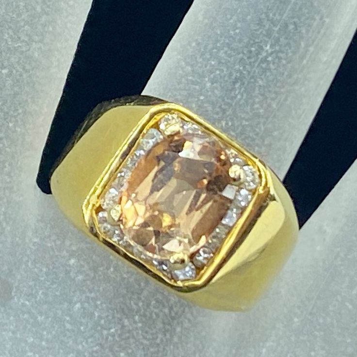 One Ornate Rich Color 14k Yellow Gold Statement Ring. In The Center 4 Prong Setting One Faceted Orange Sapphire, Approx. 10.0 X 7.6mm, Weight Approx. 2.5ct, The Sapphire Embellished With Niteen (19) Oval Cut Brilliant Diamond, Approx. 1.75 X 1.35mm, Weight Approx. 0.2ct. Ring Top Is 13.00mm Across, Ring Size 7, Weight 7.3gm, Hallmark 14k (1 Inch = 25.4 Mm; 1 Dime = 17.9mm). Ali Items Are Pre-Owned Unless Otherwise Stated. This Means They Have The Usual Aspects Of Pre-Owned Jewelry, Such As Light Scratches, Wear And Tarnish. Please Review All The Photos Which Will Be Part Of The Description. Gia Certified Yellow Gold Topaz Ring, Gia Certified Gold Gemstones For Formal Occasions, Gia Certified Gold Topaz Ring, Formal Orange Topaz Ring With Diamond, Gold Morganite Gemstone Diamond Ring, Gold Morganite Diamond Ring With Gemstone, Gold Diamond Morganite Ring With Gemstone, Formal Gold Sapphire Ring Gia Certified, Gia Certified Gold Sapphire Ring For Formal Occasions