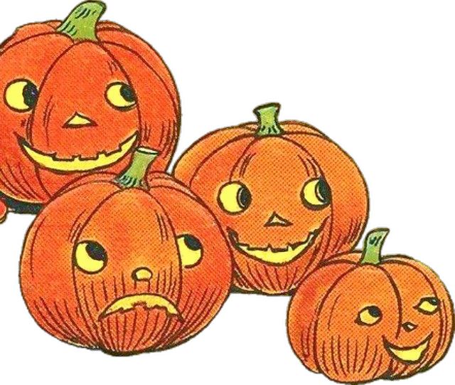 a group of pumpkins with faces drawn on them