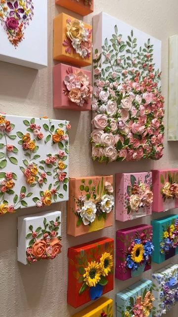 many colorful flowers are displayed on the wall next to each other in this art work