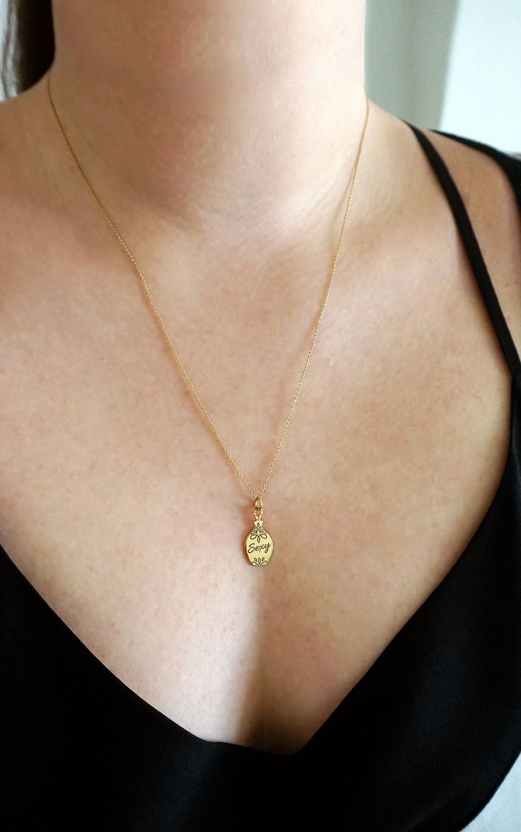 14K 9K Perfume Bottle Pendant Necklace, Personalized gold necklace, Custom Engraved gold necklace, Dainty Minimalist Layering gold necklace, FREE EXPRESS SHIPPING Beautiful and unique necklace with a small perfume bottle pendant/charm made in 14K or 9K solid gold that you can personalize with custom engraving. An amazing gift for you and your loved ones that will last forever! Add a tiny 6mm tag with an initial to make it even more special: https://www.etsy.com/listing/608018693 ---------------- Gold Plated Gold Pendant Charm Necklaces, Yellow Gold Pendant Charm Necklace With Clavicle Chain, Gold Clavicle Chain Charm Necklace In Fine Jewelry Style, Yellow Gold Clavicle Chain Pendant Necklace, Yellow Gold Pendant Charm Necklace, Gold Tarnish Resistant Pendant Charm Necklace, Gold Tarnish-resistant Pendant Charm Necklace, Yellow Gold Charm Necklace With Oval Coin Pendant, Gold Locket Necklace With Oval Pendant