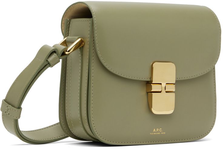 Buffed leather shoulder bag in khaki. · Burnished edges throughout · Adjustable and detachable shoulder strap · Gold-tone logo stamp at face · Tab-slot flap · Three-compartment interior · Suede and cotton canvas lining · H5.5 x W6.75 x D2.25 Supplier color: Kaw green taupe Green Office Bag With Turn-lock Closure, Luxury Olive Leather Shoulder Bag, Formal Green Bag With Turn-lock Closure, Classic Green Flap Bag With Adjustable Strap, Green Rectangular Bag With Turn-lock Closure, Luxury Olive Bag With Detachable Strap, Luxury Olive Shoulder Bag For Travel, Green Leather Flap Bag, Classic Green Flap Bag For Office