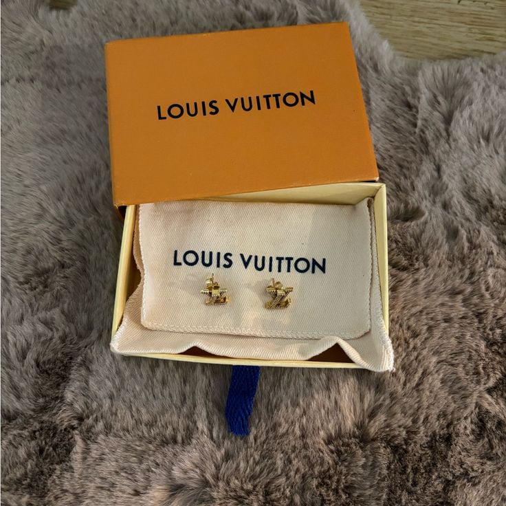 Authentic Preowned Louis Vuitton Rhinestone Stud Earrings Come With Box And Dust Bag Sold Out Super Cute Earrings They Are In Preowned Condition Take A Look At All The Pictures Goldstone Color Hardware Rhinestone Insets Lv Initials Stud Closure Poshmark Will Authenticate For You Few Scratches In The Back All The Rhinestones Are There No Missing Piece These Lv Iconic Earrings Bring To Life One Of The Most Recognizable House Signatures And Give It A Modern Update. The Lv Initials Sparkle With A Rh Stud Design, Louis Vuitton Jewelry, Missing Piece, Rhinestone Studs, Cute Earrings, Dust Bag, Initials, Super Cute, Louis Vuitton