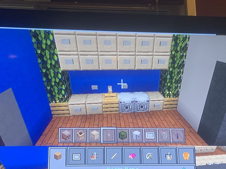 a computer screen showing an image of a kitchen and living room in the game minecraft