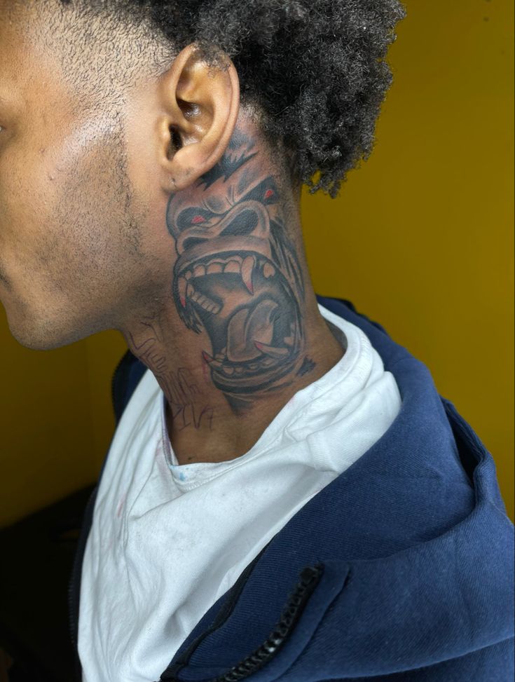 Back Tattoo For Black Man, Urban Neck Tattoos, Face Tattoo Men Black, Creative Neck Tattoos For Men, Bald Head Tattoos For Men, Hood Tattoo For Men Neck, Gorilla Neck Tattoo, Neck Tattoo Hood, Front Neck Tattoo For Guys Ideas