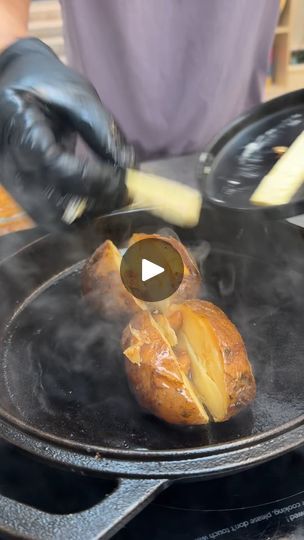 a person cooking food on top of a grill