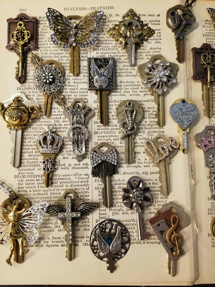 an open book filled with lots of different key pieces on top of eachother