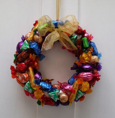 a candy wreath hanging on the front door