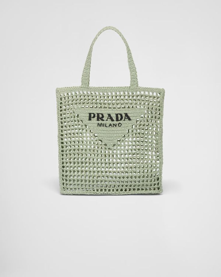 a green prada bag on a white background