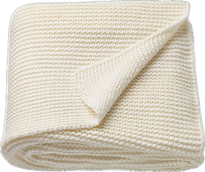 a white knitted blanket folded on top of each other