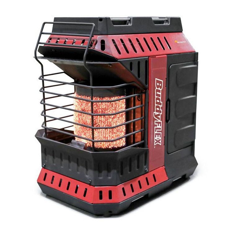 a red and black portable heater sitting on top of a white table next to a basket filled with food